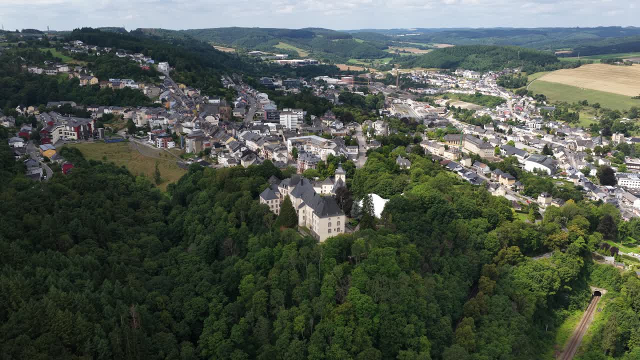 Aerial video of Wiltz Castle, Chateau de Wiltz, Schloss Wiltz, Schlass Wolz, located in Wiltz in the north of Luxembourg, dates back to 1573