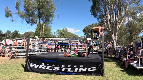 wrestlers performing at an outdoor event