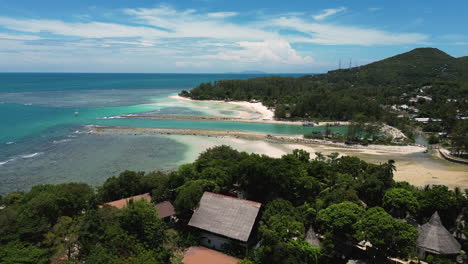 Tropical-Lagoon-Pier-in-Coastal-Paradise,-Aerial