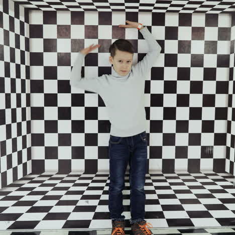 boy watching a whirlwind of optical illusion in the science center square video