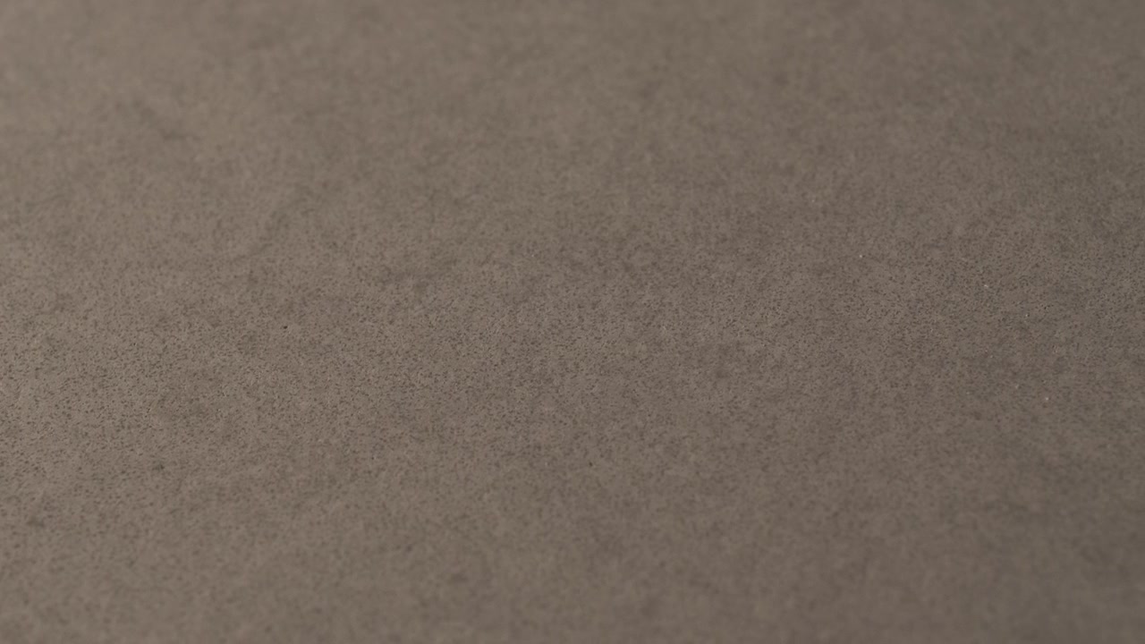 Um close-up macro de concreto de uma mesa de cozinha, em 4k 60p 10bit, ProRes422, com gravador atomos externo