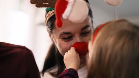 Handheld-view-of-playful-family-in-Christmas-time