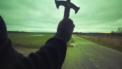 Modern-Black-Swordsman-Warrior-Awaiting-Battle-Opponent-in-Open-Field-Under-Green-Sky,-Europe,-4K-|-Muscular,-Intimidating,-Shadow,-Figure,-Blurry,-Dark-Clothes,-Powerful,-Villain,-Tapping-Finger