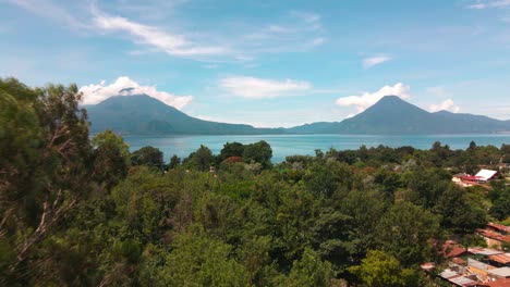 aerial fly away from lake and volcanoes - summer - lake atitlan, panajachel, guatemala