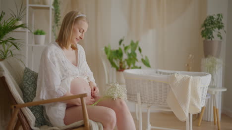 expecting mother by baby crib