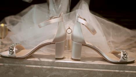 wedding ring suspended by shoes wide