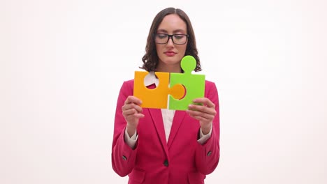 businesswoman connecting puzzle pieces