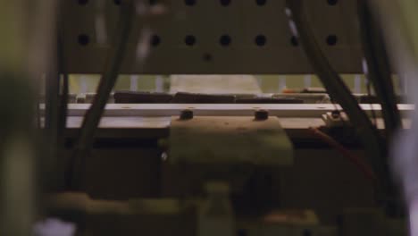 close-up of a boxspring bed assembly line in a factory, with focus on the production details