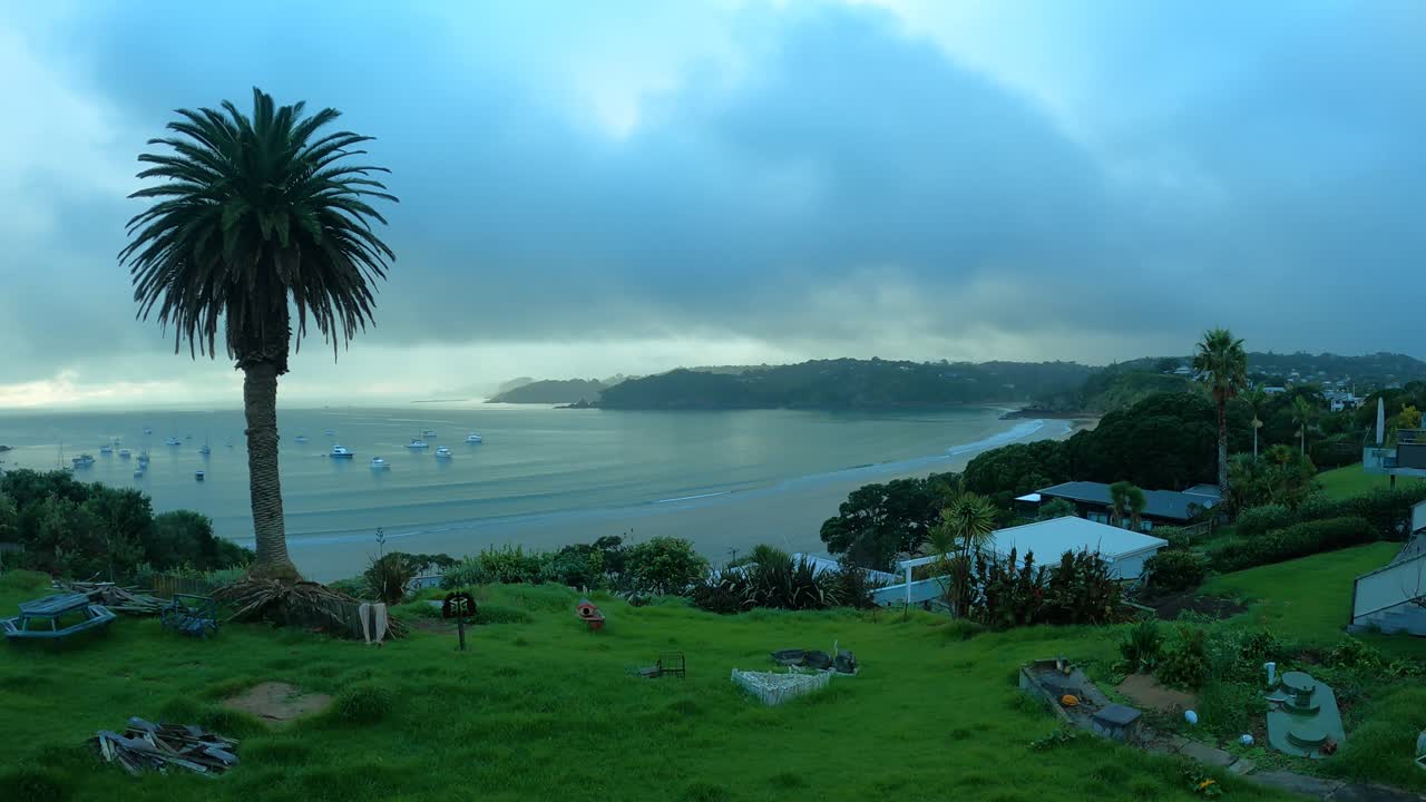 Time-lapse of storm clouds gathering and moving over Oneroa Beach and ocean, Waiheke Island, New Zealand