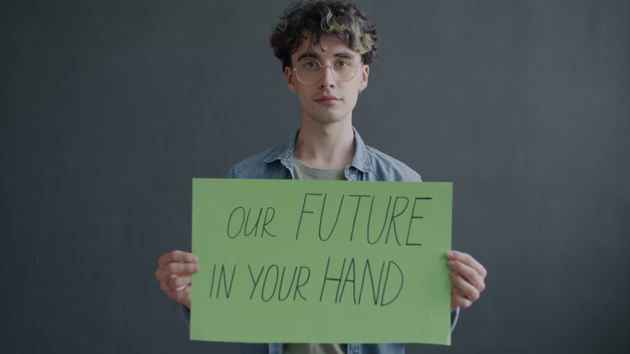 Young Person Holding Sign about the Future