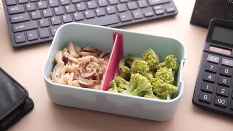 healthy lunch box with broccoli and pasta