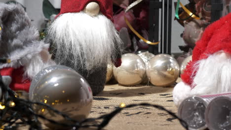 christmas decorations with toy elf and shiny balls