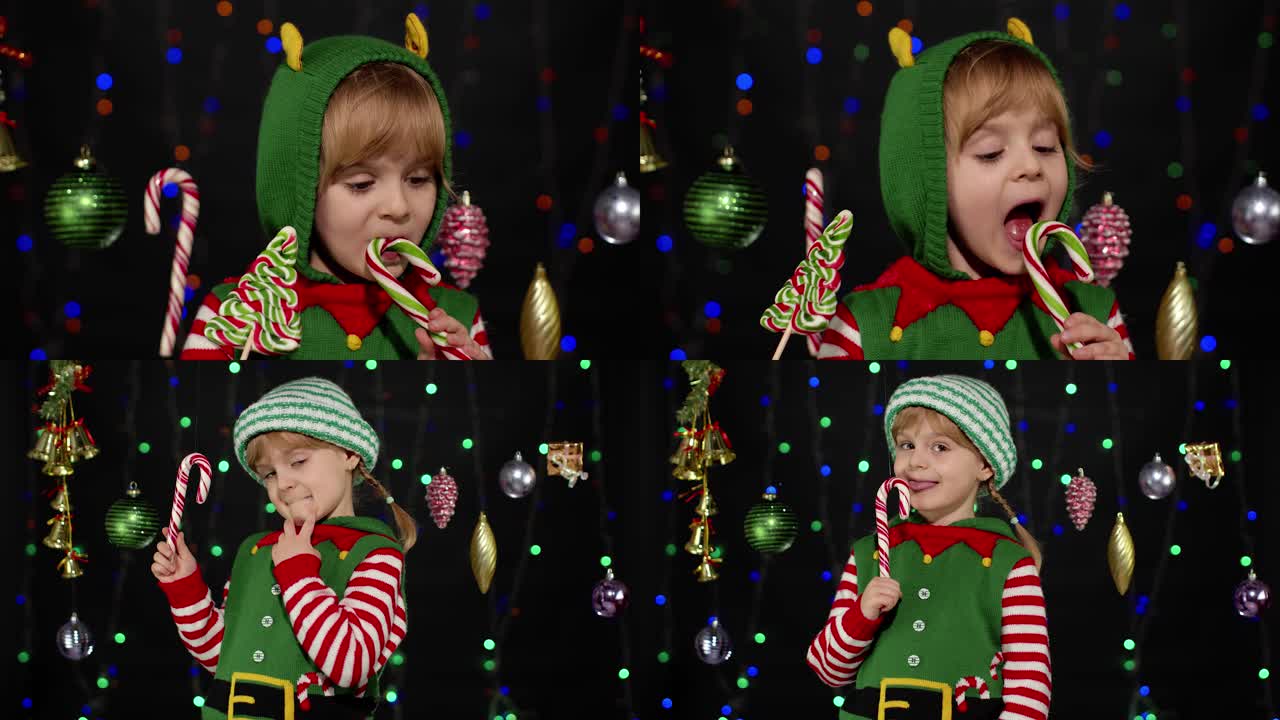 Malá dívka v kostýmu vánočního skřítka, pomocníka Santa Clause, líže lízátko ve tvaru cukrové hole a karamelové sladkosti