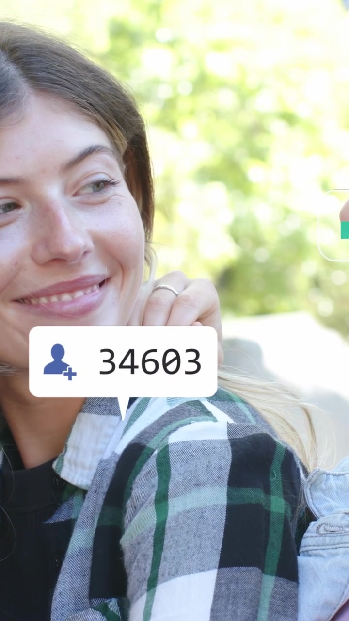 Vertical video: Plaid woman smiling while pal resting hand, making social bubbles with rising likes