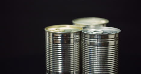 food supplies canned food rotating on black background 2