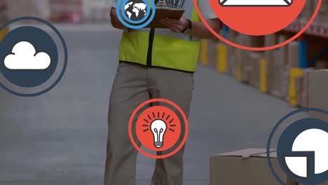 animation of media icons over caucasian male worker in warehouse