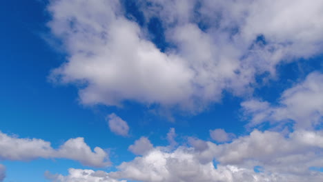 timelapse: abstract cumulus clouds cross natural empty blue sky