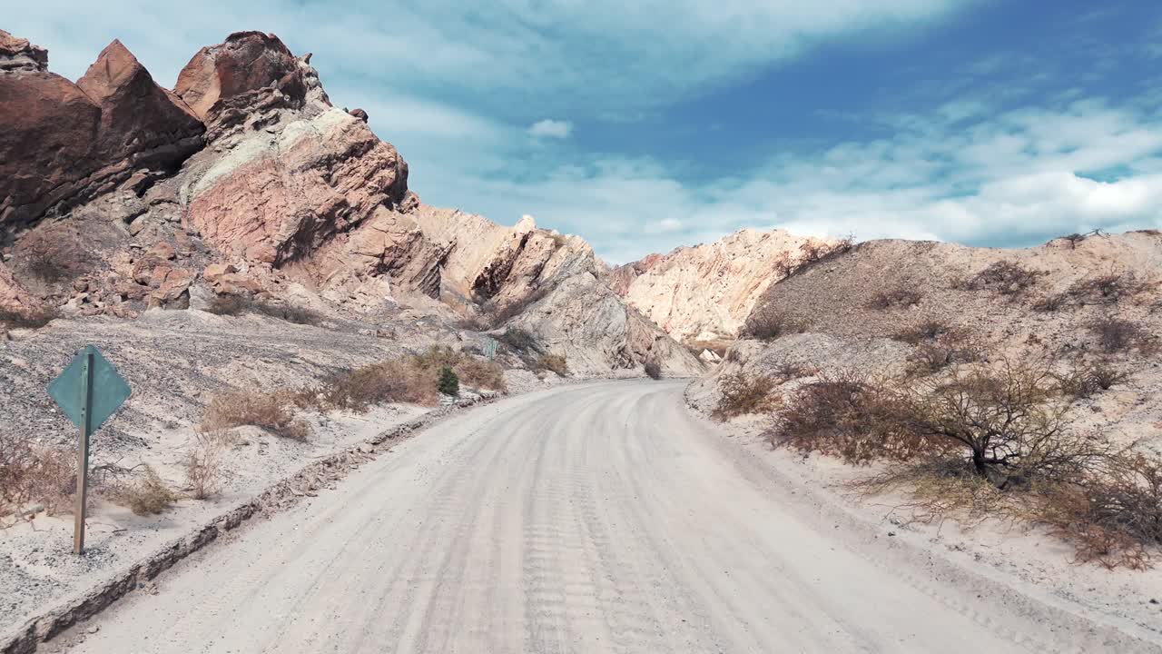 Drone advancing over the unpaved section of Route 40 in the northern Salta province, Quebrada de las Flechas, Argentina.