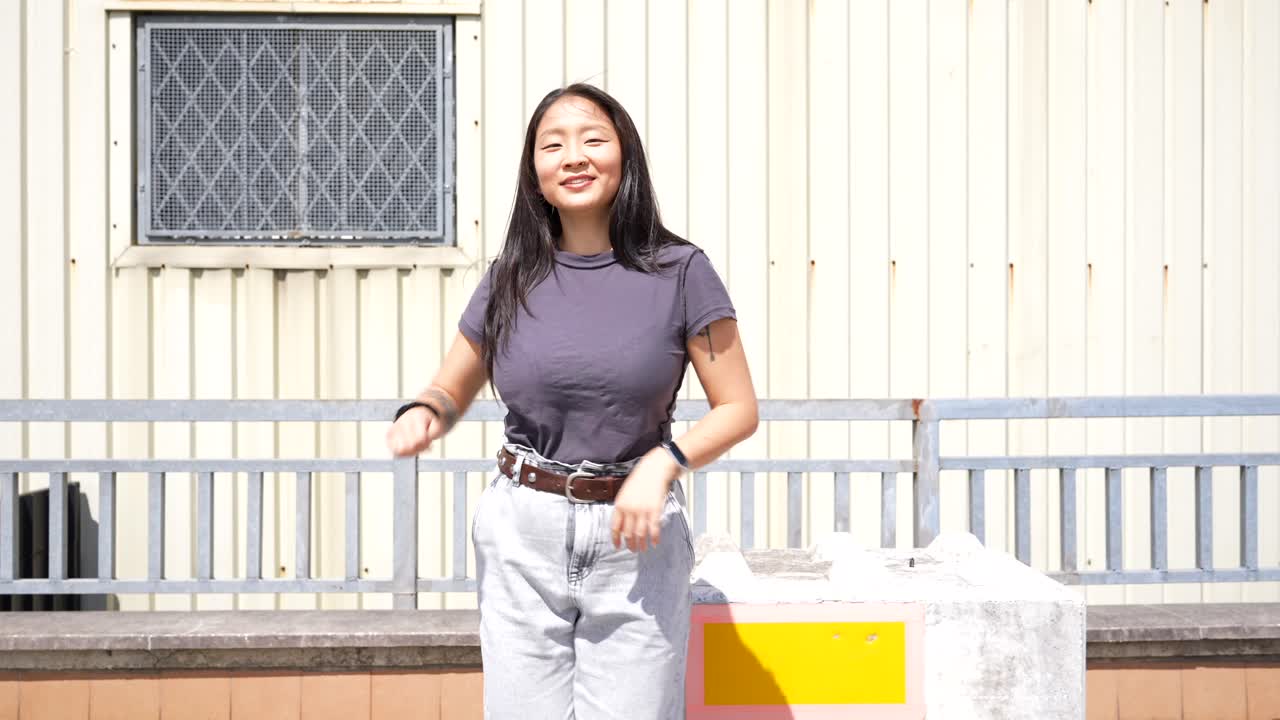 Woman in front of building