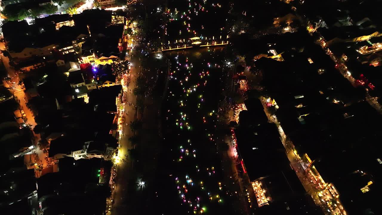 Lantern festival at night in Hoi An, Vietnam, with colorful lights and festive crowds