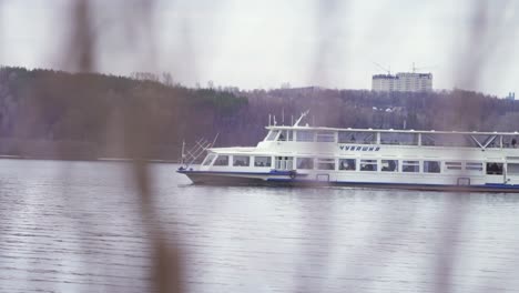 river boat on a river with buildings in the background