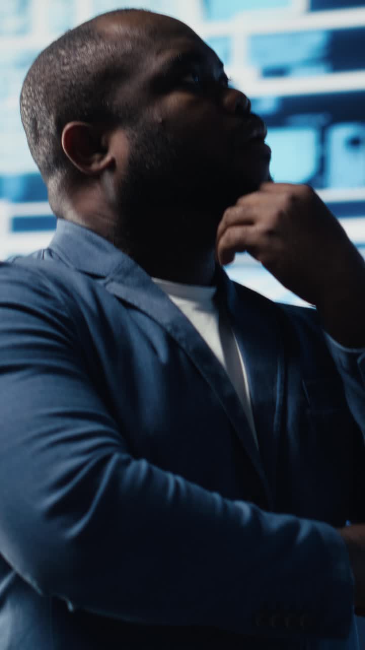 Thoughtful African American Man Contemplating in High-Tech Environment