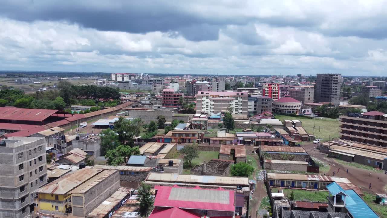 Ruiru, nairobi suburb with buildings, greenery, and cloudy sky, aerial view