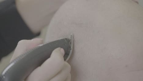 close-up of a person getting a hair cut