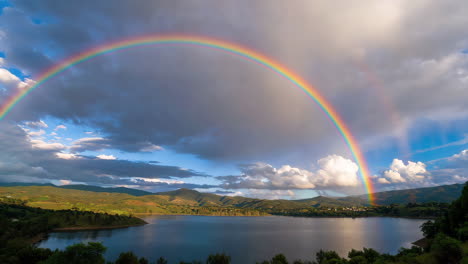 double rainbow over a mountain lake