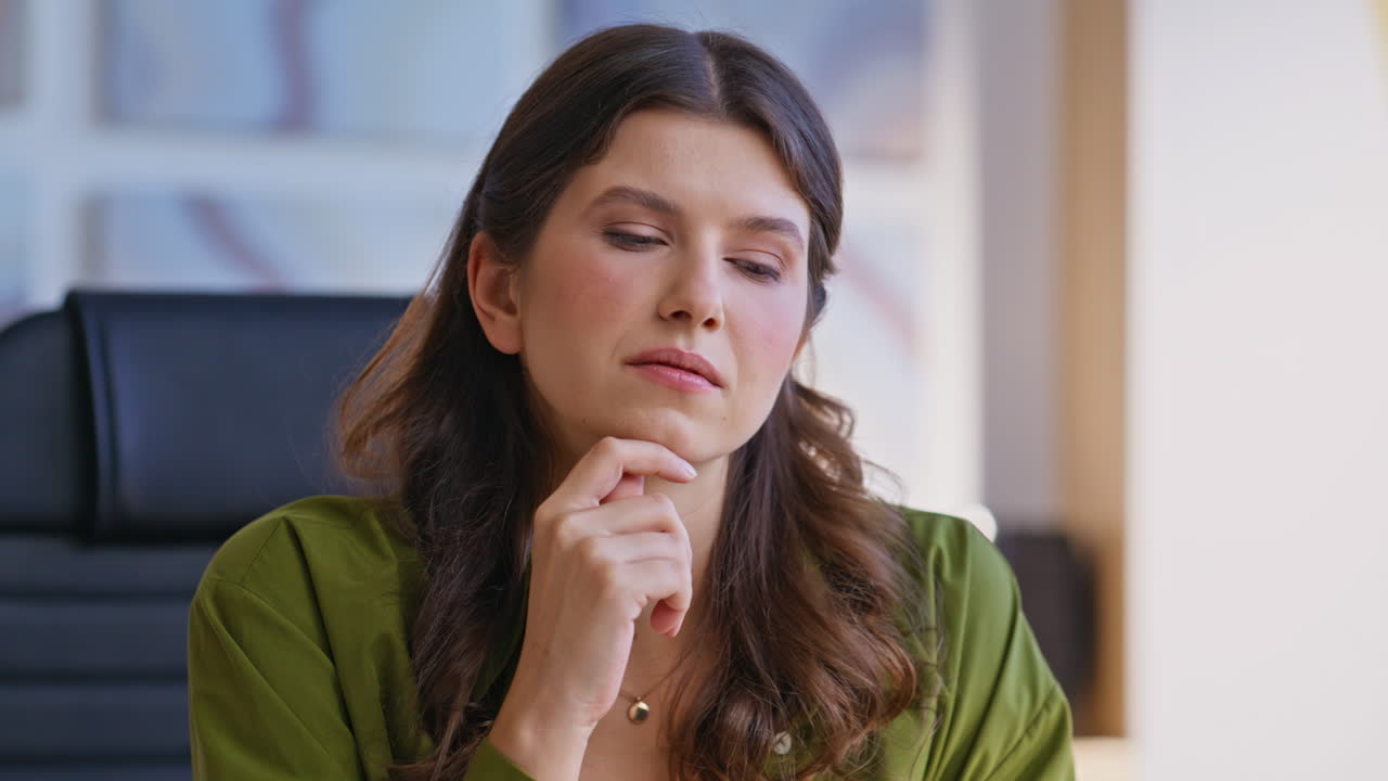 Woman Thinking in Office