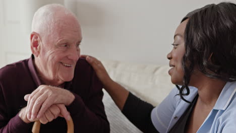 elderly man talking with his caregiver