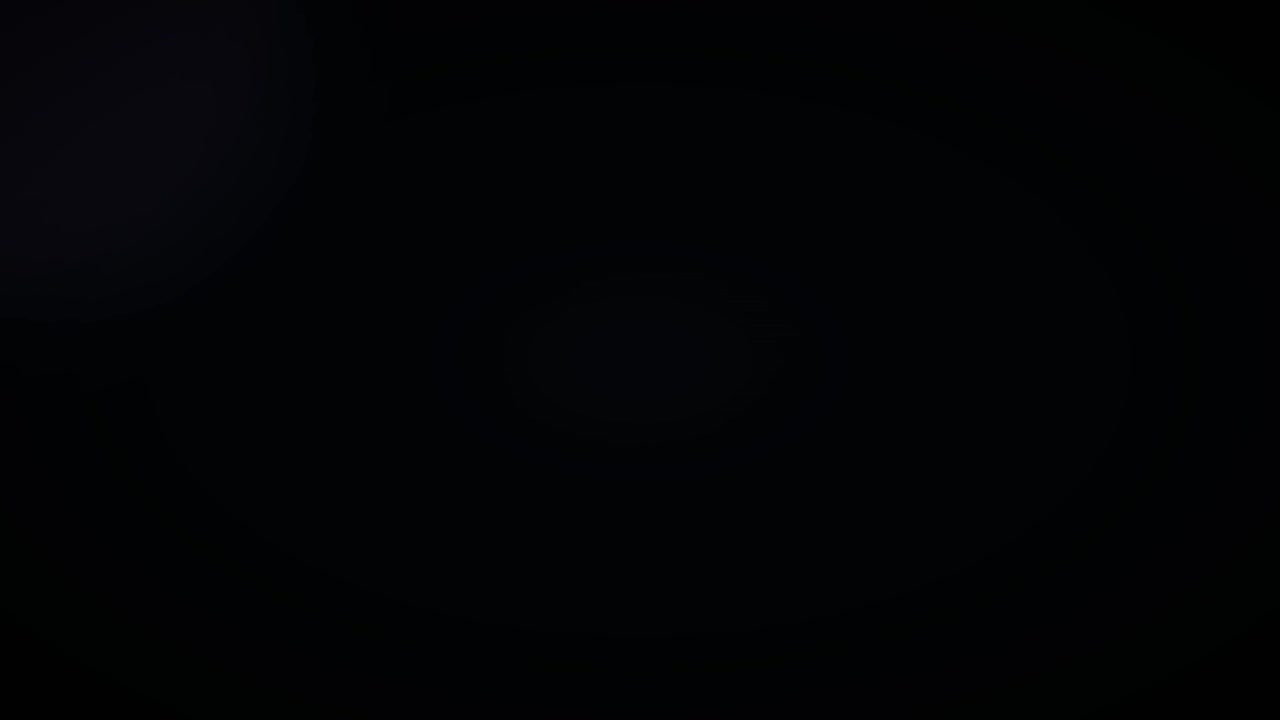 Fondo negro abstracto con un sutil destello de luz