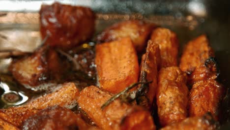 roast carrots and potatoes in bubbling hot oil