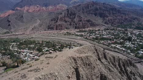 aerial pull-out of cerro de la cruz by mountains in tilcara, argentina