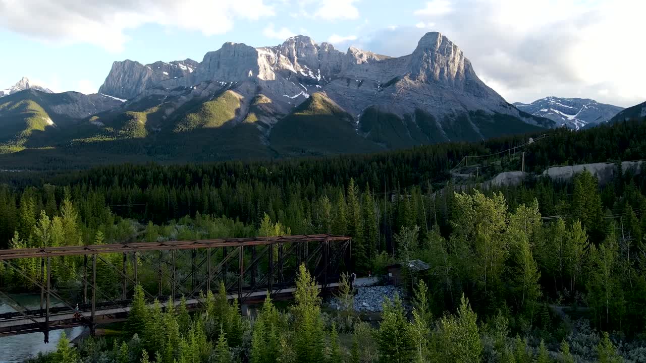 Drone shot toward mountain and bridge