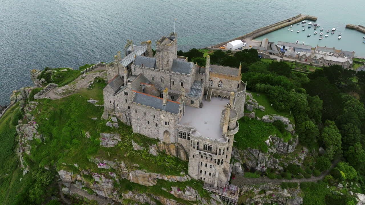Aerial View Of Saint Michael's Mount Castle Overlooking The Marina And Sea In Cornwall, England