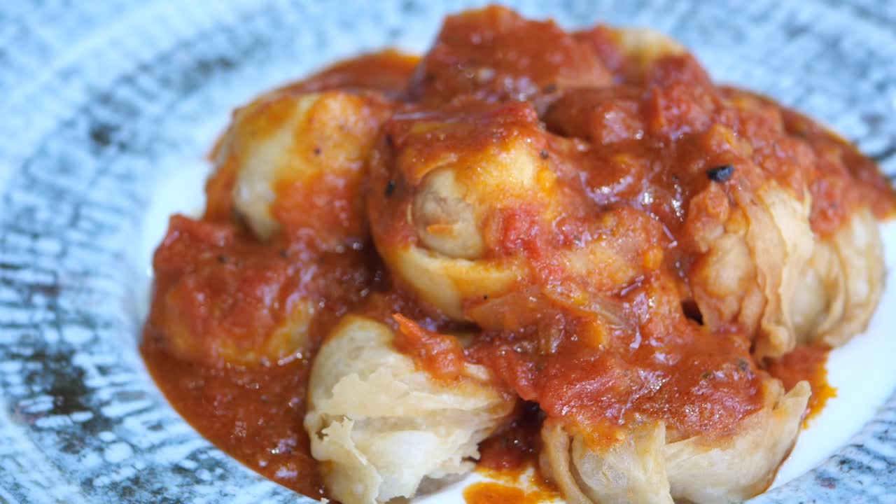 Fried dumplings with tomato sauce