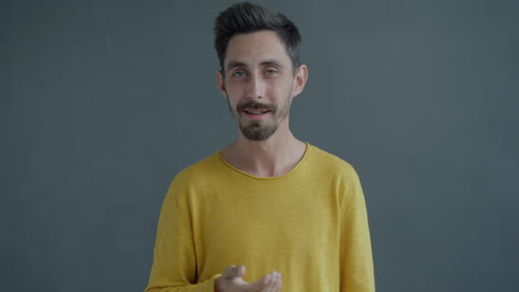 man in yellow sweater
