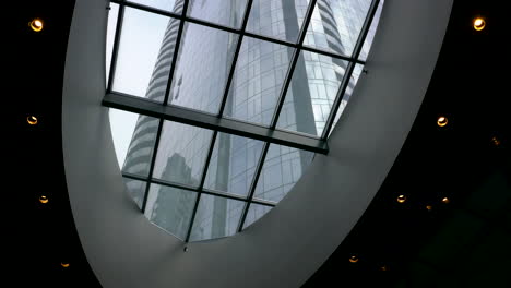 modern architecture building through glass ceiling