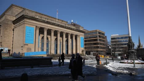 camera panning across snowy, sunny to square to city hall, sheffield