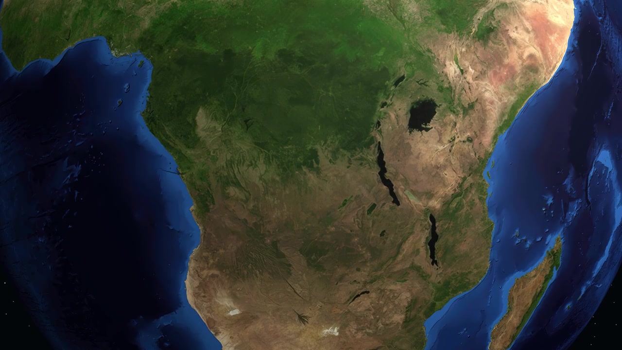 Una vista satelital se acerca desde el espacio a África, señalando Mbuji-Mayi, Congo, con coordenadas GPS precisas.
