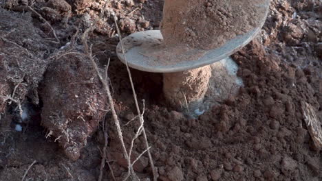 post hole digger in action
