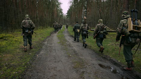 german troops marching through forest during world war ii