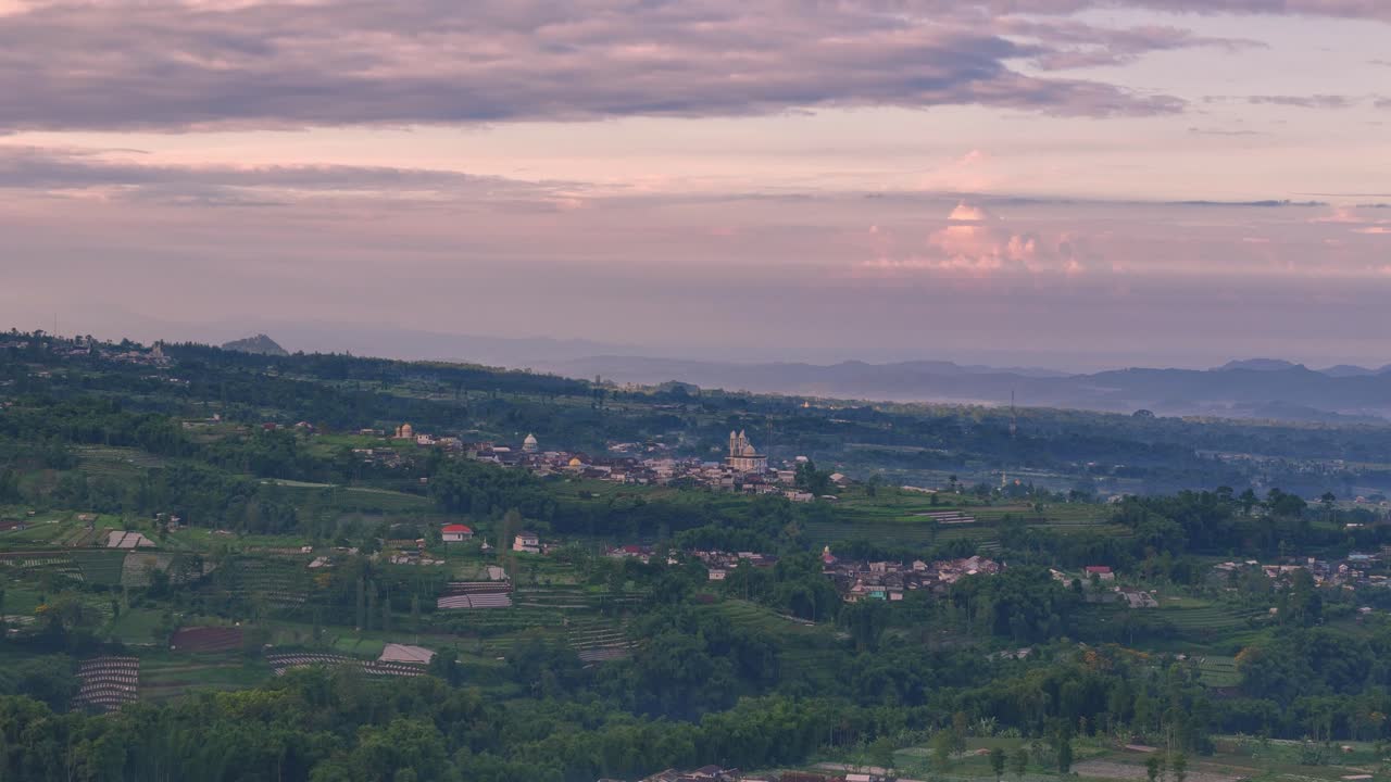Tropical view of rural highland on a foggy morning. Aerial drone scenery.
