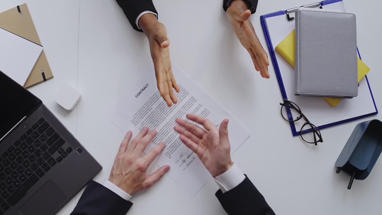 Partners arguing about contract terms, man tearing it apart. Lorem ipsum text