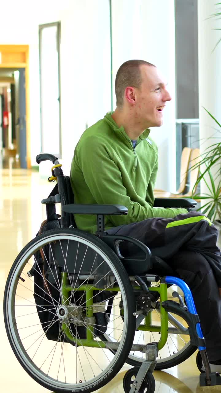 Man in wheelchair talking to friend