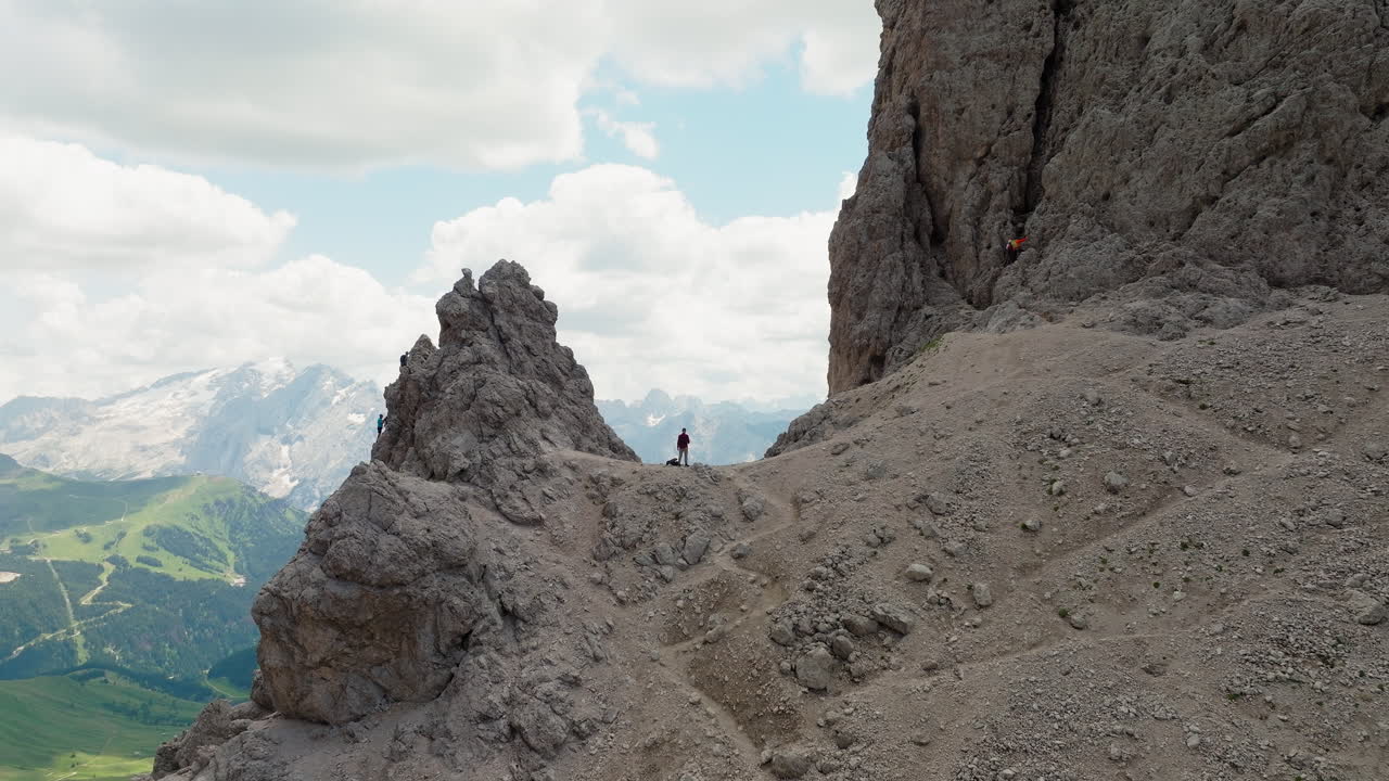 One man standing on top of Forcella del Sassolungo near Toni Demetz Hut, Dolomites, Italy