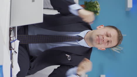 vertical video of home office worker man is fun and cheerful.