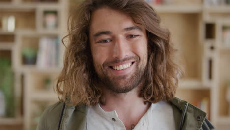 close up portrait of happy young student man smiling enjoying relaxed lifestyle handsome caucasian male with long hair real people series