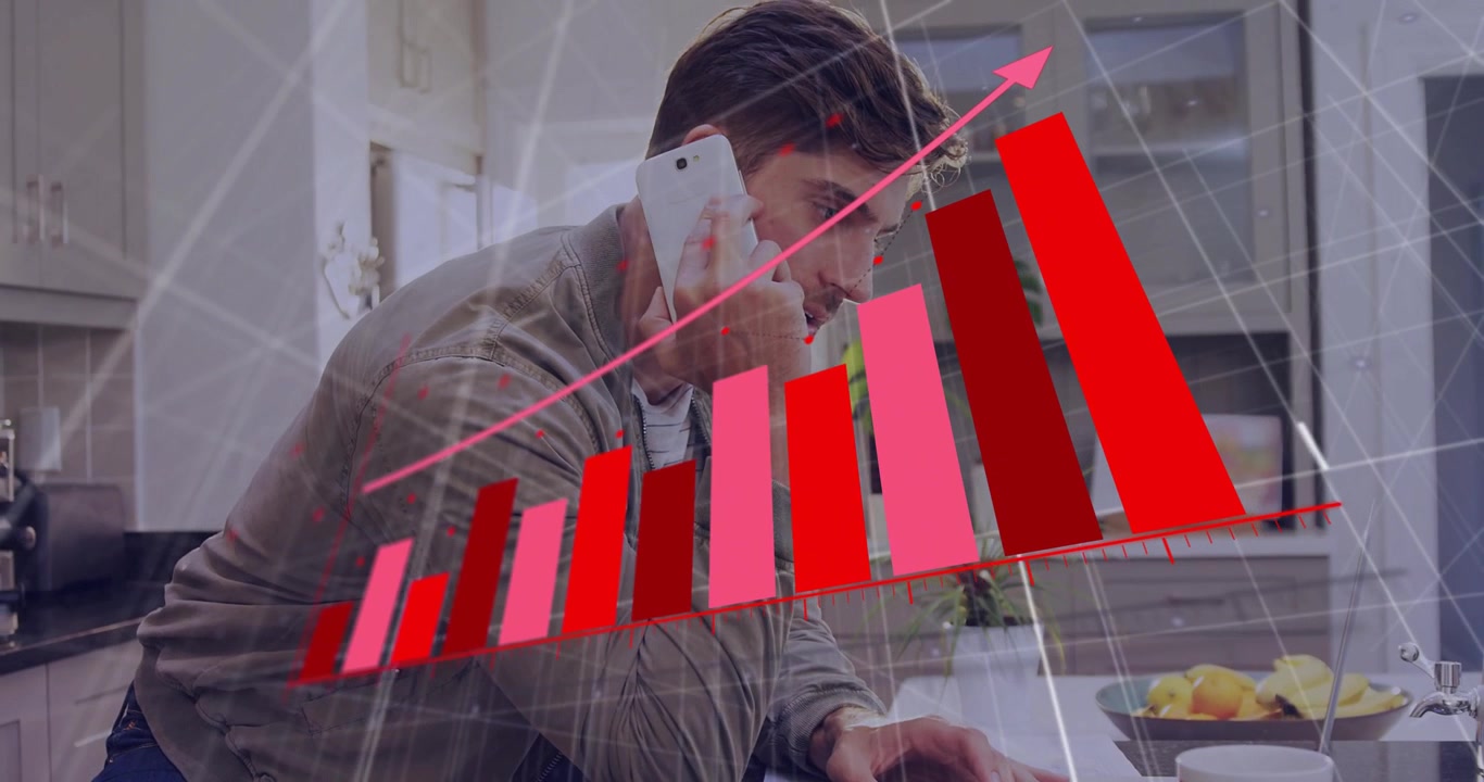 Man leaning on kitchen counter using smartphone, analyzing financial bar chart with arrow on laptop